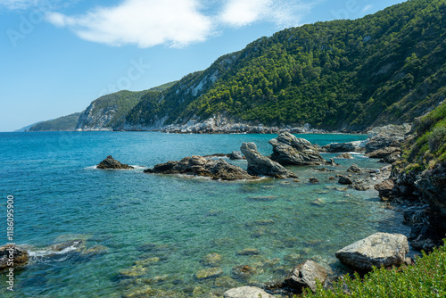 View of the sea, mountains, rocks, beaches, islands and the sky from different sides of the Skopelos island Greece.