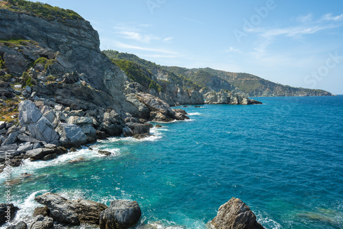 View of the sea, mountains, rocks, beaches, islands and the sky from different sides of the Skopelos island Greece.