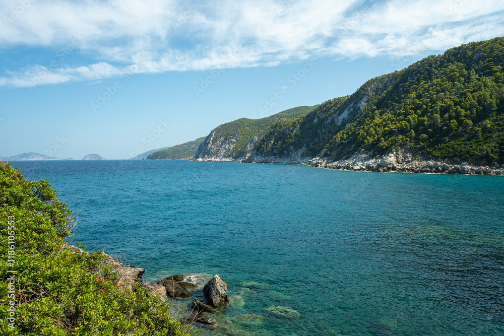 View of the sea, mountains, rocks, beaches, islands and the sky from different sides of the Skopelos island Greece. View of the sea, mountains, rocks, beaches, islands and the sky from different sides of the Skopelos island Greece.