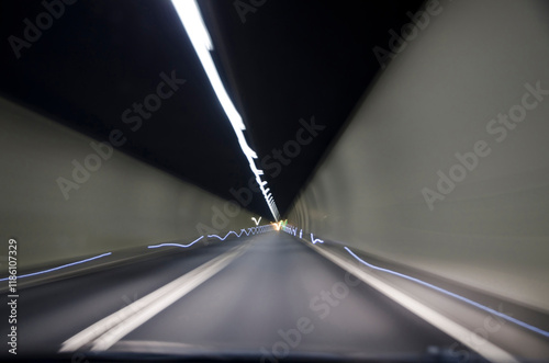 Illuminated Narrow Tunnel in San Bernardino, Grisons, Switzerland. photo