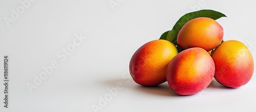mangos set against a white ...
