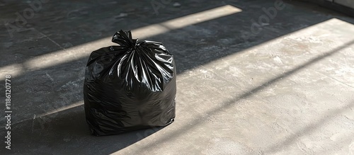 A black garbage bag placed ...