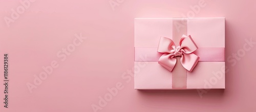 Gift box with a bow on a pi...