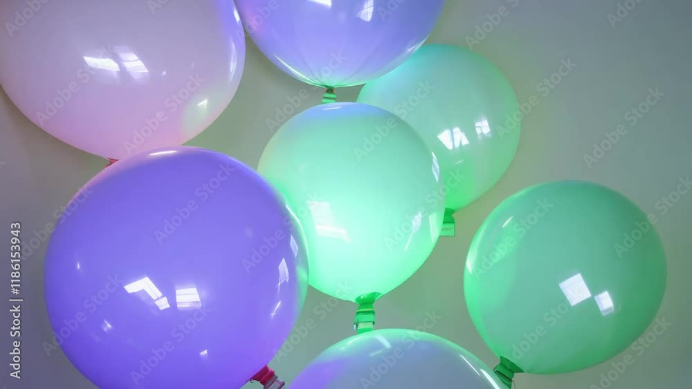 Ethereal 360-degree rotation video, pastel purple and green balloons, soft light, translucent glow, faint strings, softly lit backdrop, panoramic composition, ample negative space
