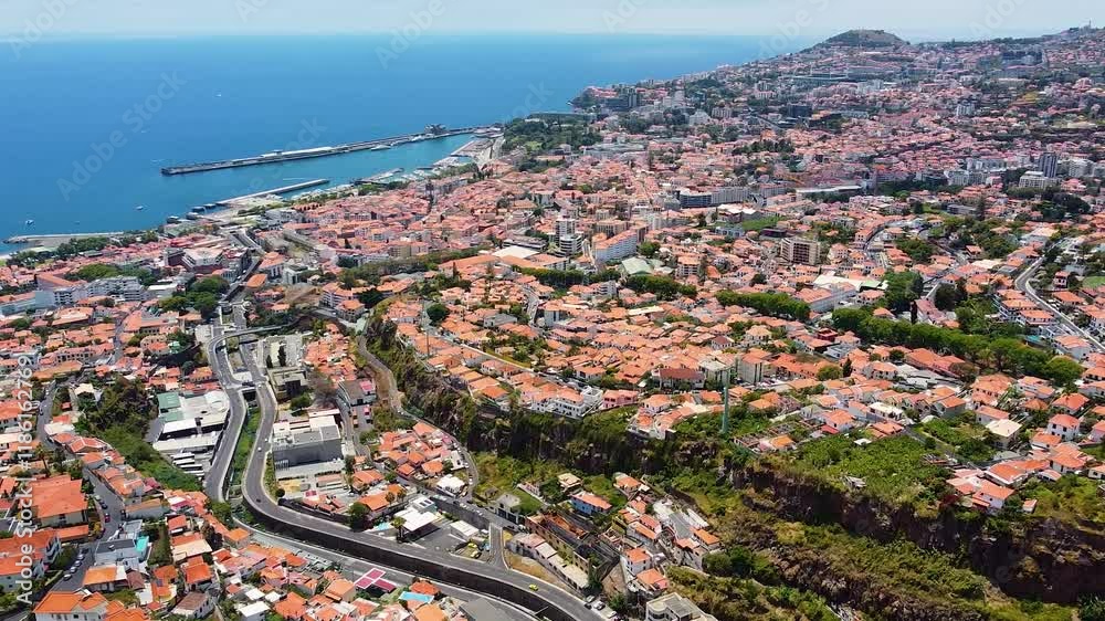 The city of Funchal, the capital of the Portuguese island of Madeira, a view of the city from a drone, streets and houses of the city