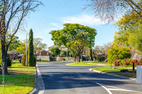 a typical Melbourne neighborhood, with neat family homes nestled amongst established trees and a sense of peaceful suburban living. Werribee, Australia. photo