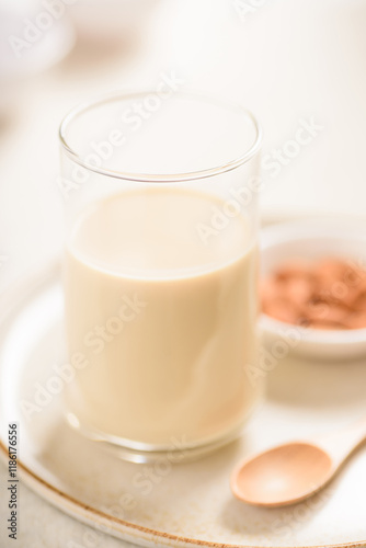 Almond milk is a healthy non-dairy alternative product, free from lactose, rich in protein and vitamins for a good lifestyle. photo