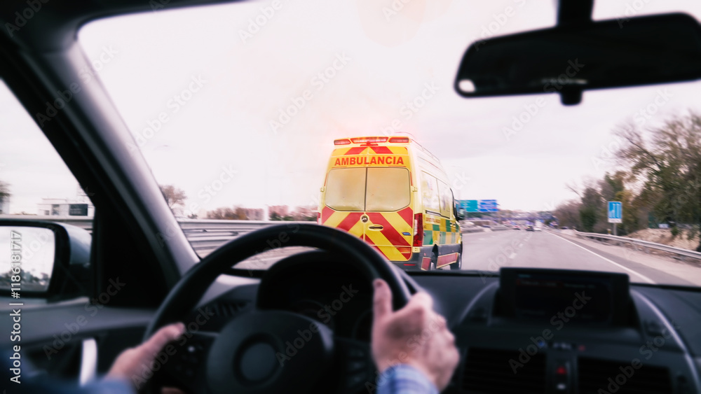 Driver following an ambulance on the highway in madrid