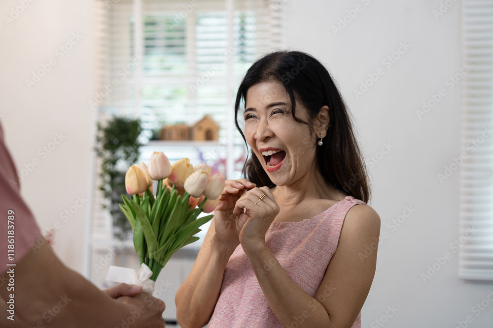 Romantic Valentine's Day Celebration with Joyful Woman Receiving Bouquet of Flowers in Bright Home Setting Romantic Valentine's Day Celebration with Joyful Woman Receiving Bouquet of Flowers in Bright Home Setting