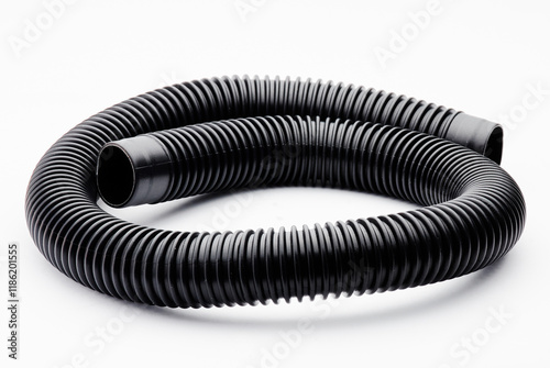 Close-up view of black ribbed flexible plastic hose, commonly used in vacuum cleaners, plumbing, and machinery for air or liquid transfer. Industrial component with versatile, practical applications.. photo