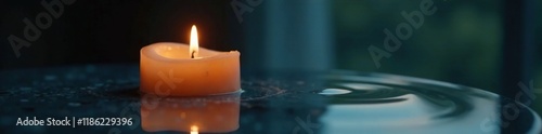 A solitary candle burns beside a mirror with rippling water, subtle, soothing