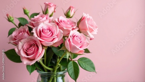 Pink roses in a vase with fresh green branches and leaves, flower arrangement, pink rose