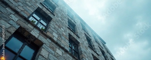 Stone fa?ade with windows reaching towards the misty clouds, grey, windows, building photo