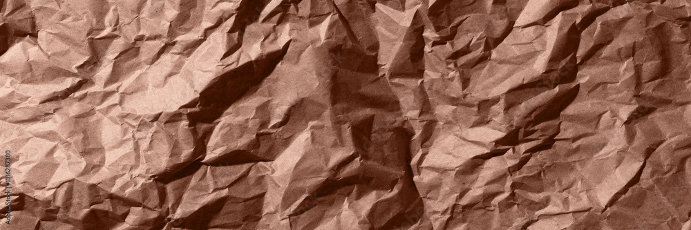 Fototapeta premium Brown, mocha mousse crumpled, wrinkled recycle craft paper texture background banner