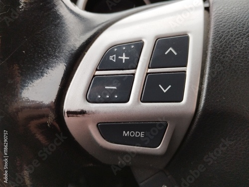 Audio system control buttons on the steering wheel of a car. Multi-steering wheel and sound control in a vehicle. photo