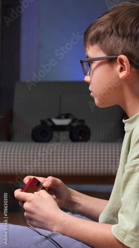 vertical video Young boy playing retro video games at home