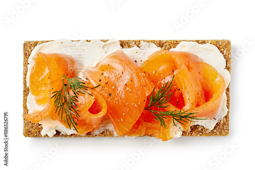 Crispbread with salted salmon slices and cream cheese isolated on white background