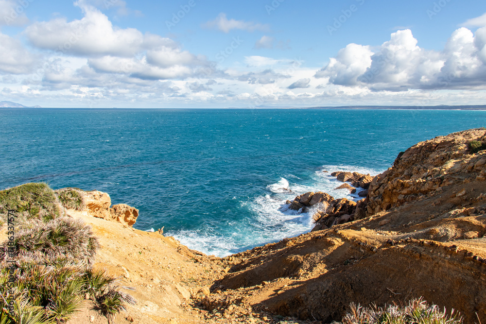Port aux Princes, Tunisia, Cliffs and Rocks, Mediterranean Sea landscape with beautiful blue sky. Heavenly Escape. Takelsa Port aux Princes, Tunisia, Cliffs and Rocks, Mediterranean Sea landscape with beautiful blue sky. Heavenly Escape. Takelsa