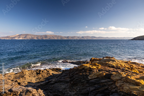 Obraz na płótnie Gold Moon Beach. Beautiful landscape of the sea of Greece during a sunny day in Mikrolimano. Travel to Greece. w salonie
