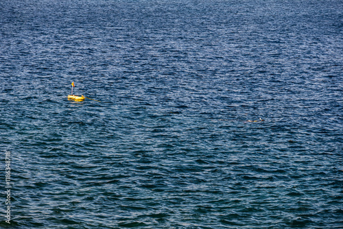 Obraz na płótnie Diving in Mediterranean sea. Photo with a diver swimming under water with a diving tank next to it. w salonie