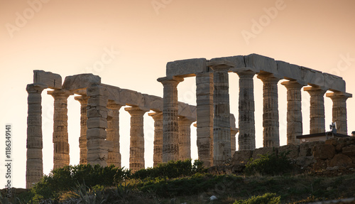 Obraz na płótnie Temple of Poseidon. Beautiful landscape with warm light sky before sunset over Poseidon Temple at Sounion Cape from Greece. Visit and travel to Greece. w salonie