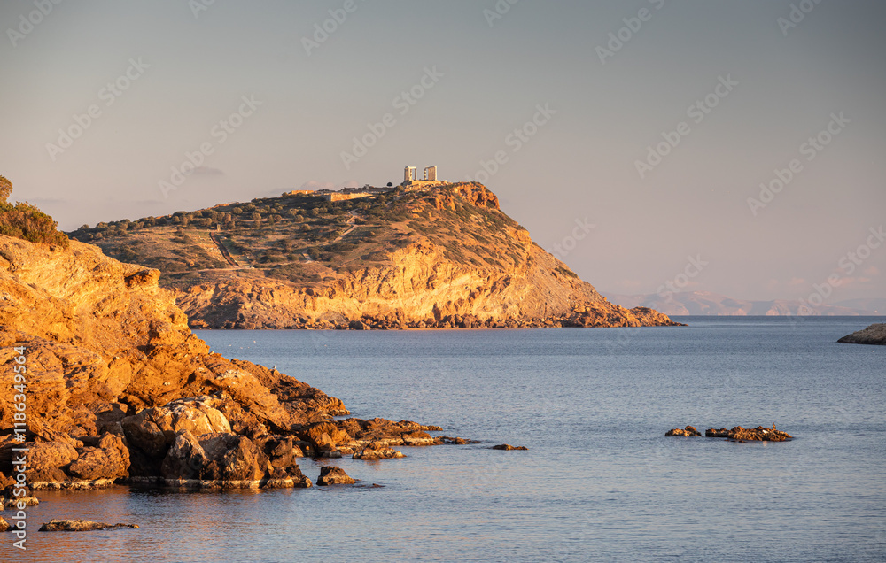 Cape Sounion and Temple of Poseidon. Beautiful sunset over Mediterranean Sea in Greece next to Posideon Temple and Sounion Cape. Amazing landscapes of Greece.
