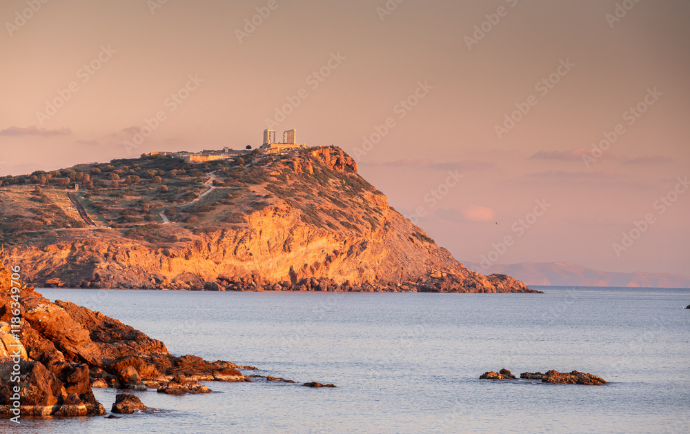 Cape Sounion and Temple of Poseidon. Beautiful sunset over Mediterranean Sea in Greece next to Posideon Temple and Sounion Cape. Amazing landscapes of Greece.