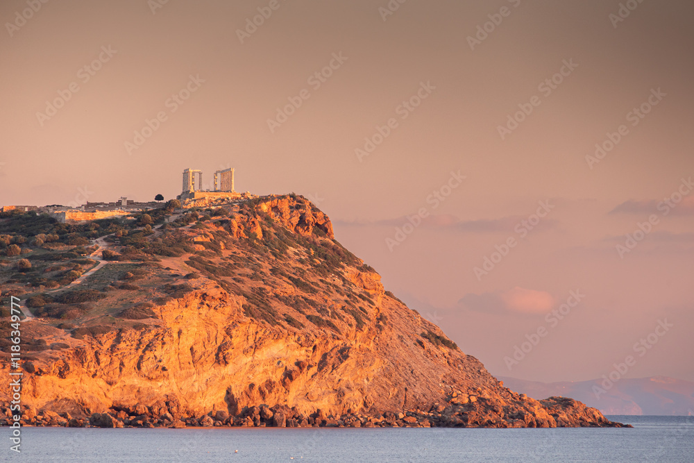 Cape Sounion and Temple of Poseidon. Beautiful sunset over Mediterranean Sea in Greece next to Posideon Temple and Sounion Cape. Amazing landscapes of Greece.