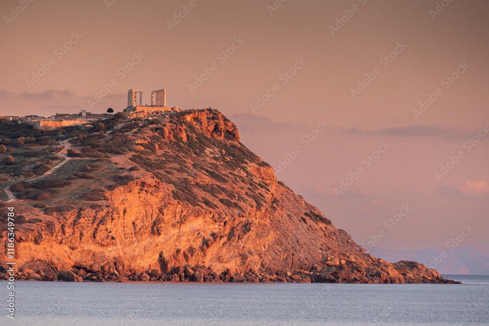 Cape Sounion and Temple of Poseidon. Beautiful sunset over Mediterranean Sea in Greece next to Posideon Temple and Sounion Cape. Amazing landscapes of Greece.