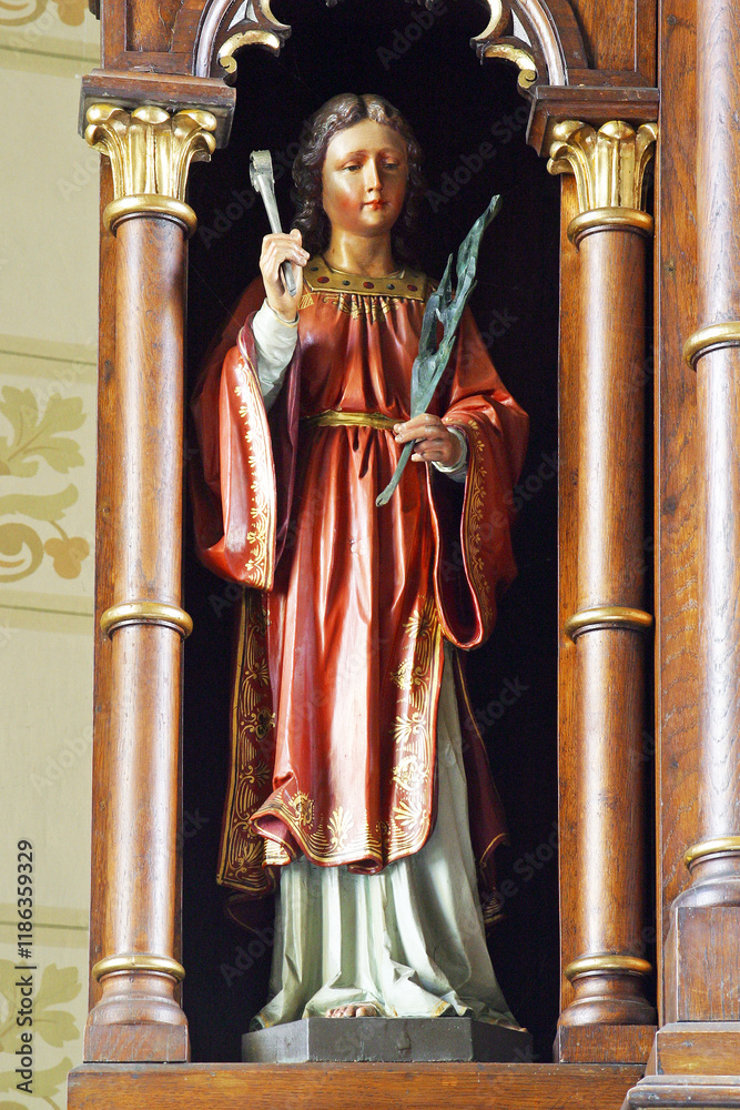 Obraz premium Saint Apollonia, statue on the altar of Saint Barbara in the parish church of the Assumption of the Virgin Mary in Resnik, Croatia