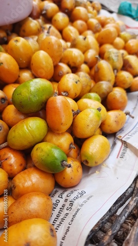 siriguela madura exposta em feira photo