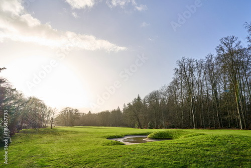A wintery sunrise over a lucious green golf course