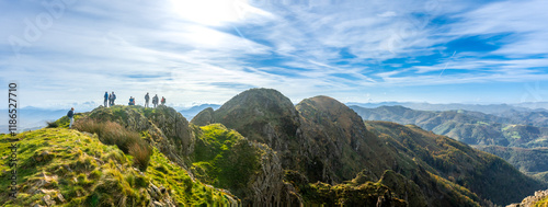 Quadro su tela Hikers contemplating breathtaking panorama from aiako harria mountain in basque