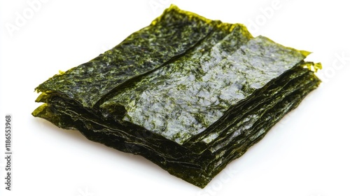 Dried nori seaweed sheets stacked on a white background showcasing their vibrant green color and crisp texture