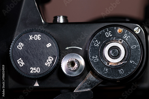 Frame counter disc, shutter button and shutter speed dial on a film camera