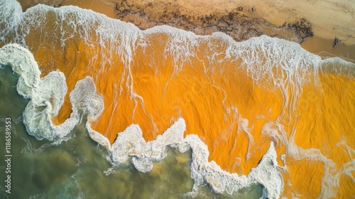 Aerial View of Turbulent Ocean Waves with Unique Orange Patterns and Shoreline Highlights photo