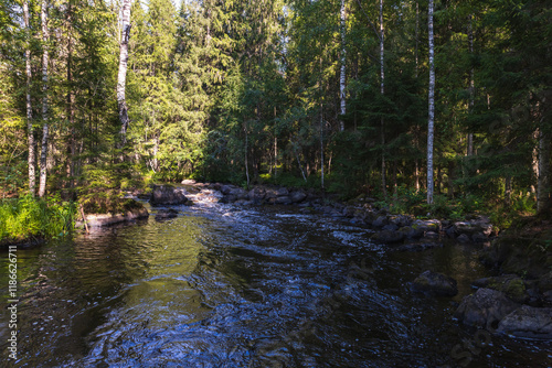 Karelian landscape with a river in the forest on a sunny day. Ruskeala photo