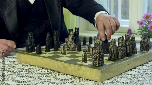 Ancient Chess Game. Elite Medieval Pieces. Man and Woman in Historical Costumes. Chess is a Board Game for Two Players. International, Western Chess. Abstract Strategy Game with no Hidden Information.