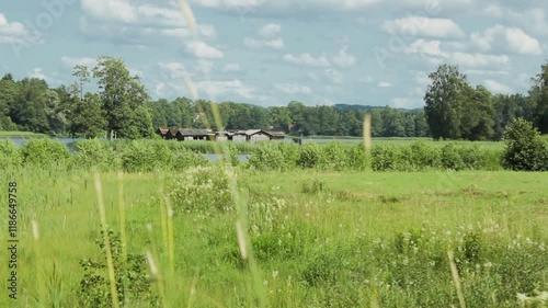 Medieval Wooden Village on an Island in the Middle of a Lake. Araisi Lake Dwelling Site with Reconstructed Remnants of Latvian Prehistory. It is Important Archaeological Site. photo