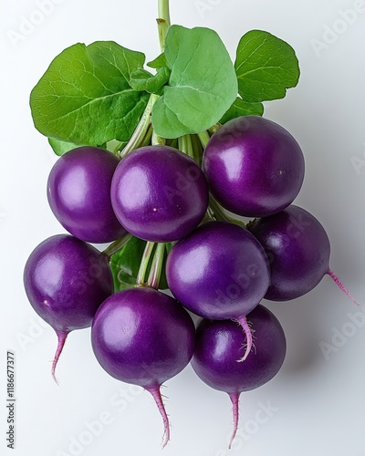 A bunch of vibrant purple radishes, freshly harvested, with their green leaves still attached, displayed against a clean white background. photo