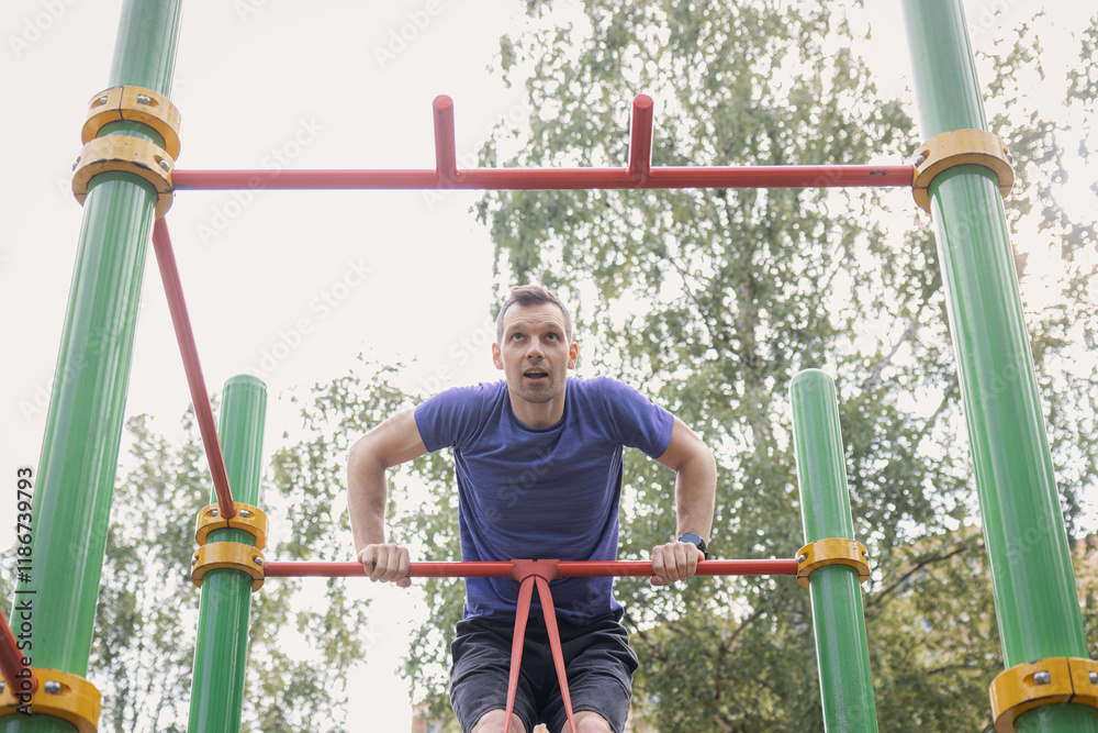 Fototapeta premium Muscle-Up Training on Outdoor Bar