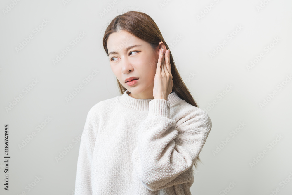 Tinnitus concept, sick asian young woman, girl have ear pain or earache, hand touch plug ear, suffering painful otitis from loud of noisy sound, inflammation. Health care nerve deaf eardrum disease. Tinnitus concept, sick asian young woman, girl have ear pain or earache, hand touch plug ear, suffering painful otitis from loud of noisy sound, inflammation. Health care nerve deaf eardrum disease.