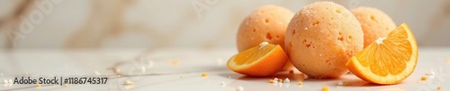 Orange apricot sorbet balls on a marble surface, sphere, marble, orange apricot photo