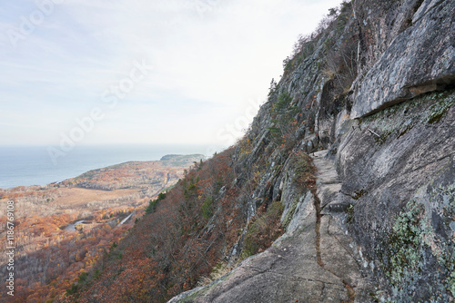 фотографія The precipice is a narrow trail that runs along a steep cliff face