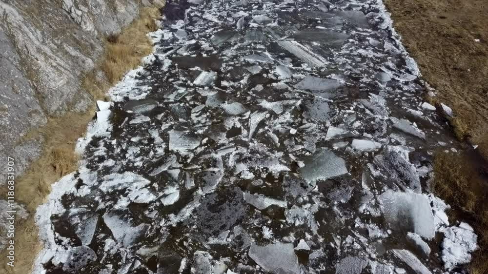 Exploring Ice Fragmentation in a Beautiful Winter Landscape Filled with Scenic Serenity. Clip Exploring Ice Fragmentation in a Beautiful Winter Landscape Filled with Scenic Serenity. Clip