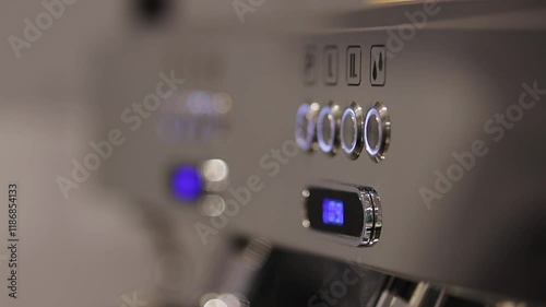 Closeup of modern coffee machine at restaurant or cafe. Small business and professional coffee brewing concept. modern metal coffee machine close up. horizontal shot