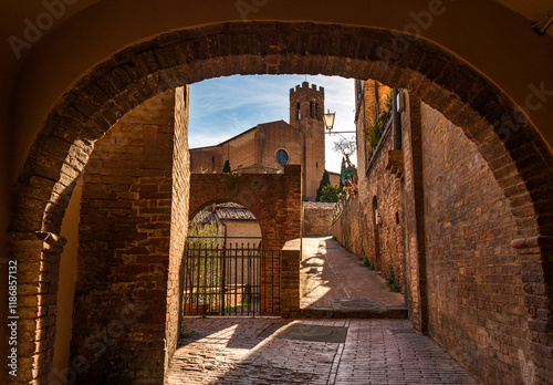 alley of Siena with St. Domenico church in the background photo