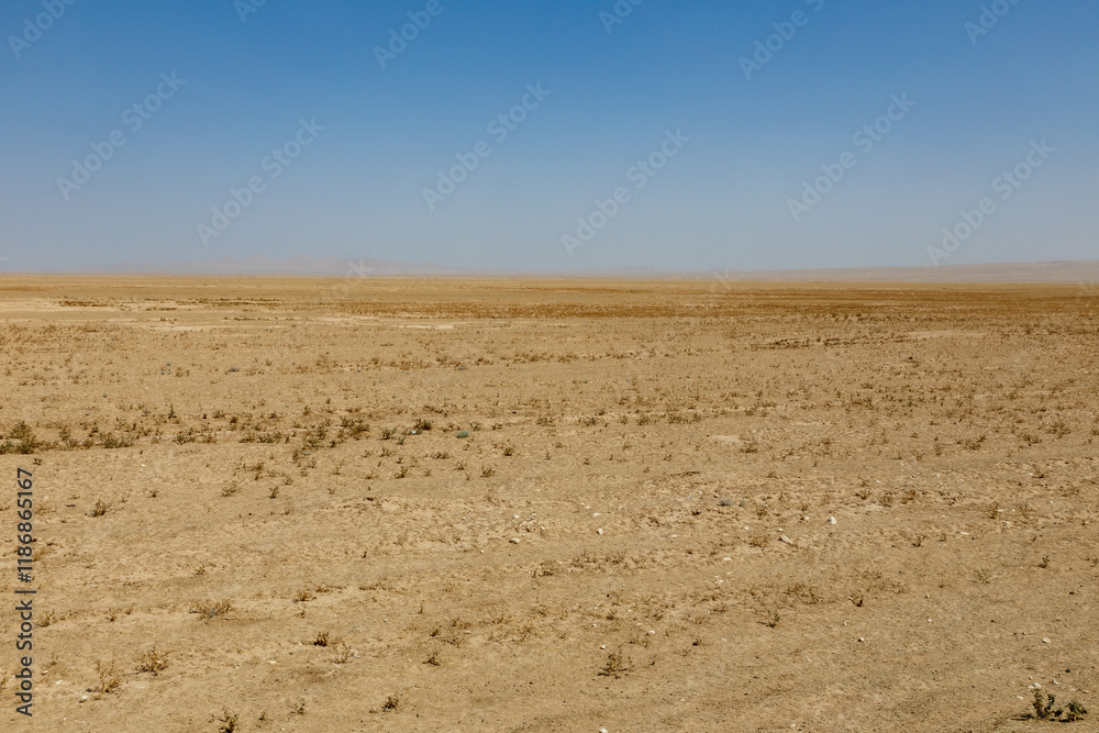 Expansive desert landscape in Kunduz Province showcasing arid terrain and distant horizons Expansive desert landscape in Kunduz Province showcasing arid terrain and distant horizons