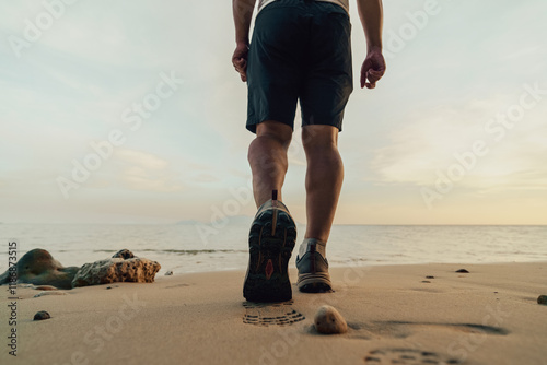 person walking on the beach photo