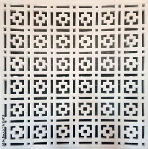 Gypsum geometric shapes in interior. Geometric design. Beautiful ornament background close-up. Seamless plaster ornament with geometric squares. Abstract background